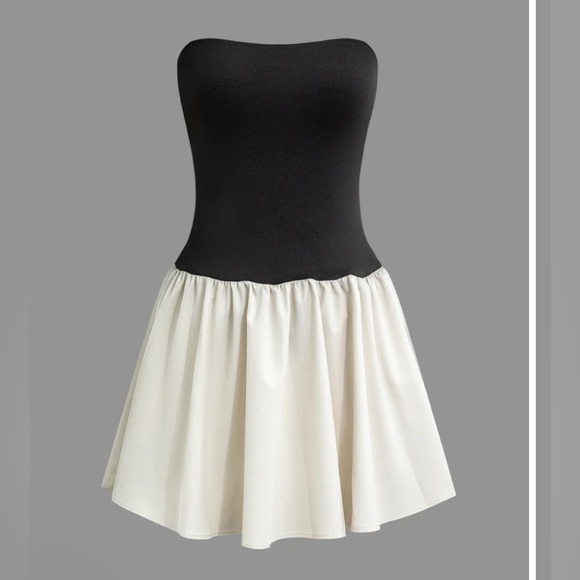 Mini tube dress with featuring a black top part and cream bottom from Micas. - Picture 1 of 5